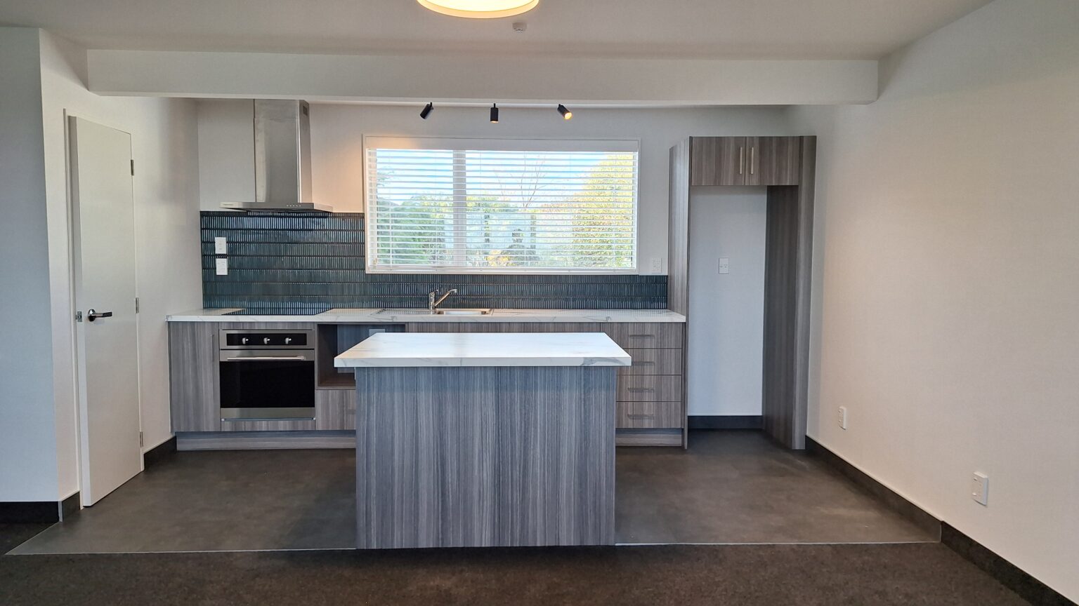 Modern wood look compact motel kitchen